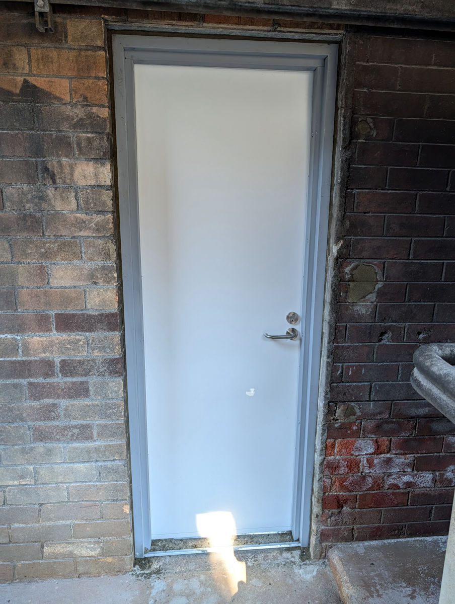 Fire door installed in an external brick opening in the Illawarra